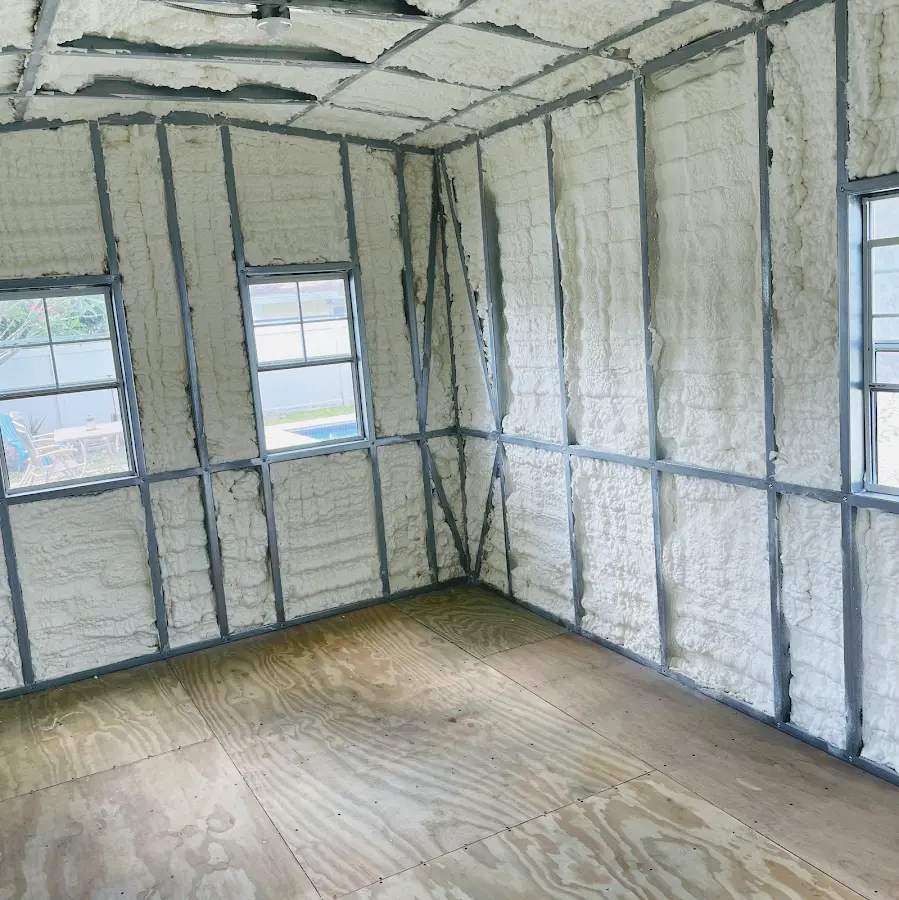 Closed-cell spray foam insulation applied to wall cavities in a residential project in Moon